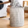102805-a1d0fb.webp Stylish Checkered Cloth Laundry Basket